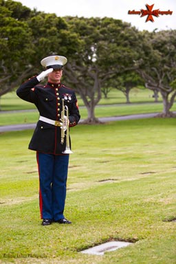 A U.S. Marine Salutes a Grave marked unknown