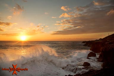Seascape Photography, sunset and crashing waves Kaena point Oahu, Hawaii