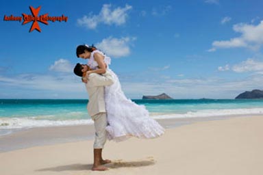 Hawaii Beach Wedding Photography - Groom lifting Bride at Waimanalo beach