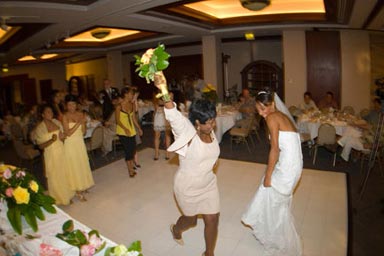 Wedding Photo of Bouquet Toss at Wedding Reception in Kailua Hawaii