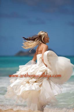Bride Dancing on the white sands of Waimanalo Beach Oahu Hawaii