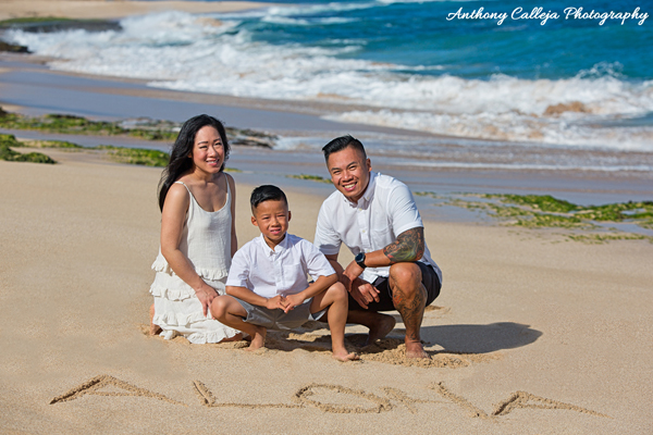 Ton Family Portrait at Papailoa Beach with Aloha written in the Sand