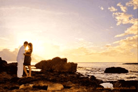 Photographer Near KoOlina Beach Club Engagement Young couple at Sunset at Secret Beach Oahu Hawaii