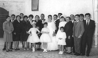 Caruana Wedding Portrait - Circa 1964 - Groom Raymond Zaren Micallef and Bride Lucia Caruana - photo includes bride's paternal grand mother Nanna Vittoria Caruana, Bride's parents John Caruana Katarena Caruana, siblings, uncle Anthony Caruana, his wife Rita Caruana, his children Charles and Joyce, Aunt Marija Caruana and her son Victor Caruana.