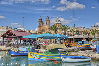 Marsaxlokk  is a small, traditional fishing village in the Southern Region of Malta. It has a harbor, and is a tourist attraction known for its views, fishing and history. 